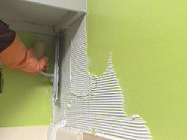 apply thin set to wall with a notched trowel apply thin set to wall with a notched trowel