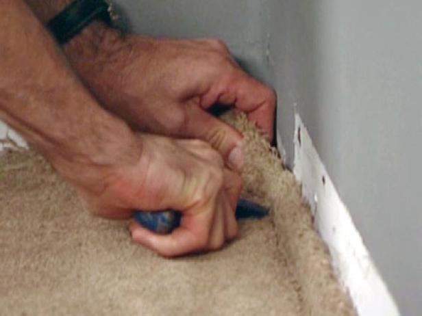 tuck carpet under wall edge using an awl tuck carpet under wall edge using an awl