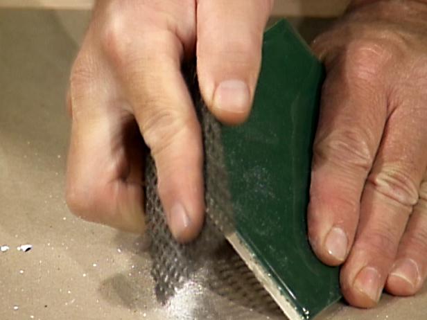 a file is used to smooth rough edges of cut tile a file is used to smooth rough edges of cut tile