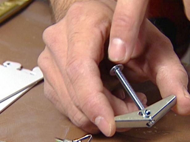 Butterfly bolts work by drilling a hole and inserting the bolt with the metal "wings" down; the wings open up inside the hole to hold a large screw securely in place. The only thing with butterfly bolts is they can never be taken out again.