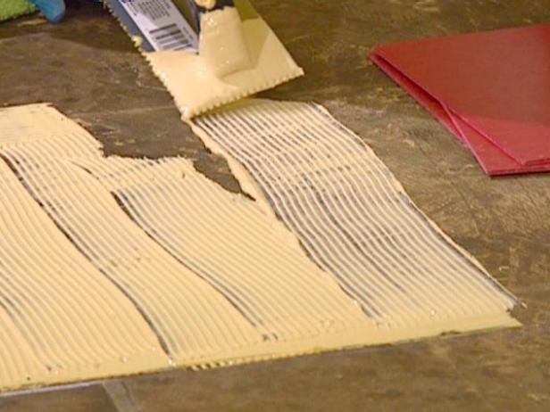 notched trowel used to spread adhesive on to floor notched trowel used to spread adhesive on to floor