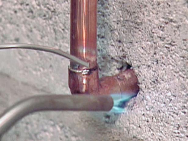 solder copper pipe in place at coupling and joint solder copper pipe in place at coupling and joint