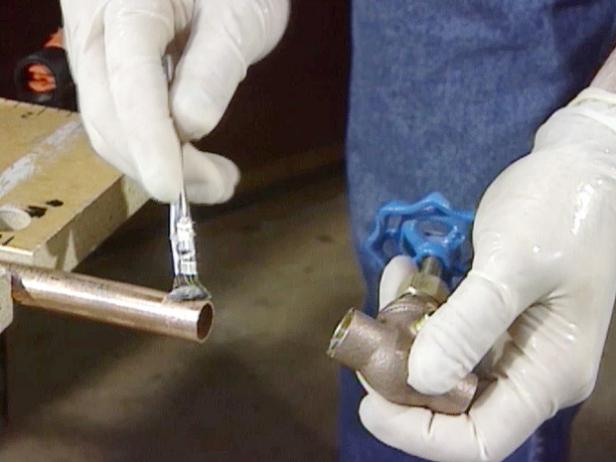 spread soldering flux on outside of pipe spread soldering flux on outside of pipe