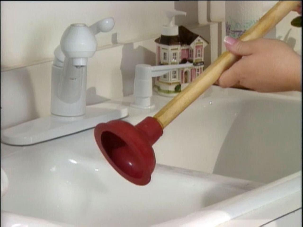 How can you unblock a sink without a plunger?