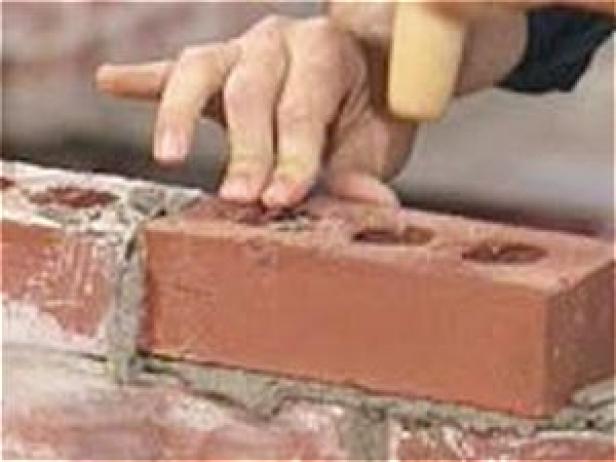 use trowel handle to set bricks and release air use trowel handle to set bricks and release air
