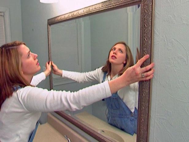 place mirror on hangers and then adjust to level place mirror on hangers and then adjust to level