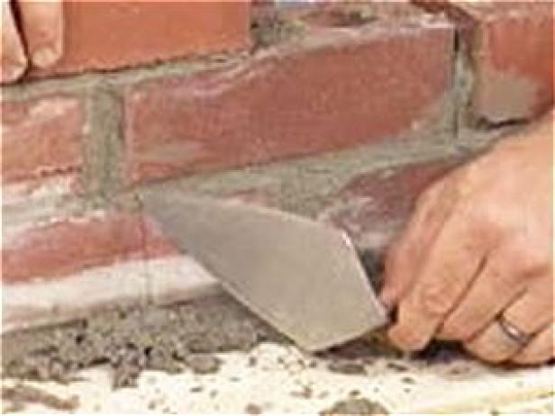 apply generous amount of mortar with spade trowel apply generous amount of mortar with spade trowel
