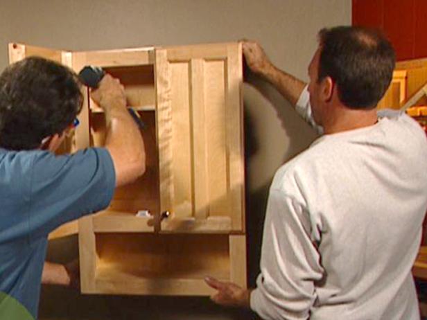 secure one side of the cabinet at a time secure one side of the cabinet at a time