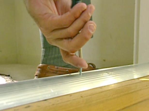 cut old threshold and dislodge with pry bar cut old threshold and dislodge with pry bar