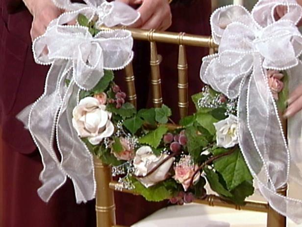 swags tied to back of chairs using extra ribbon swags tied to back of chairs using extra ribbon