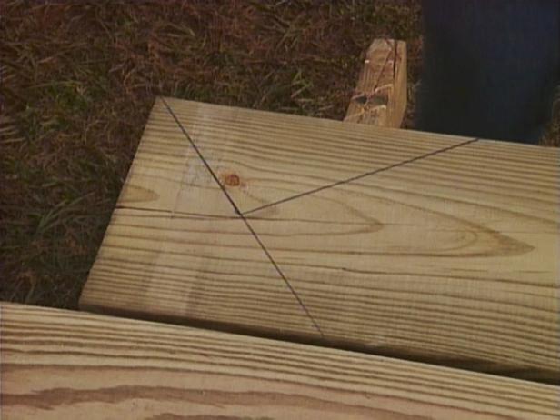 The top step will be attached to the deck therefore you won't need a riser. Instead, create a return by drawing a straight line along the mark you made from the corner of the board.