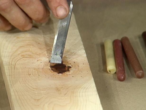 scrape hole top with chisel to remove excess wax scrape hole top with chisel to remove excess wax