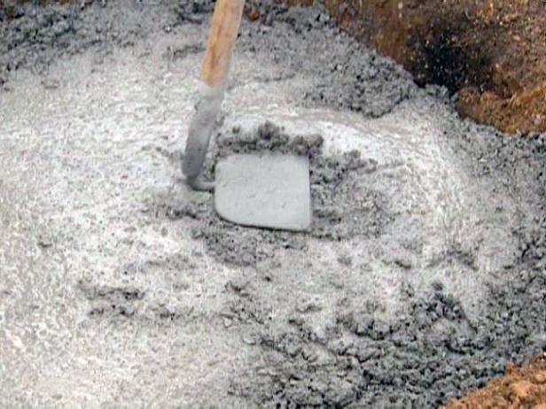 tamp concrete with back of hoe to spread it out tamp concrete with back of hoe to spread it out