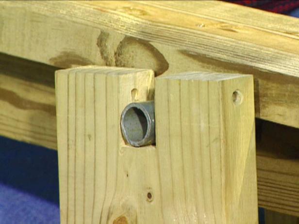 Drill 1/4" holes in both uprights to allow placement of locking pins -- metal dowels that will keep the pivot bar in place.