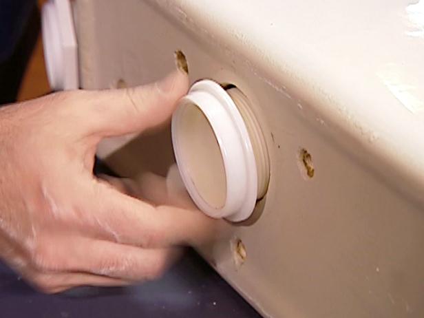 To install the Douglas Valve, carefully line up the valve and gently push it though the hole. Then, turn the ring until it locks tight. To ensure you have a tight seal, use a pair of large pliers to finish tightening.