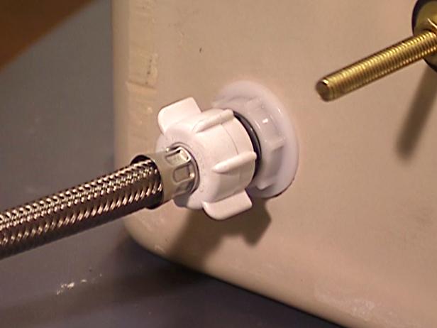 Once your tank is reinstalled, it's time to tighten the water line. First, tighten the line as best you can with your hand. After you have hand tightened your line, use an adjustable wrench to ensure that the water line is secured to the tank. Once you have secured the line, you can safely turn your water back on.