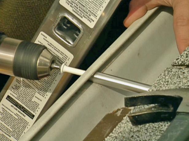Install a new threaded spike using a drill. Repeat the process until all of the spikes have been replaced one by one.