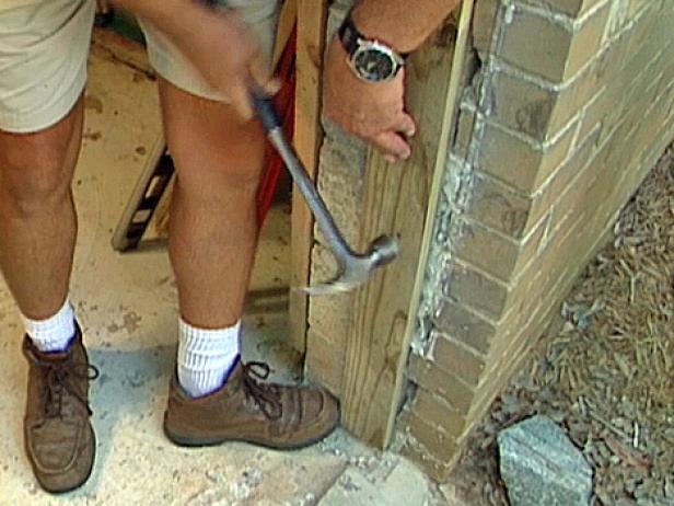 Step 5: Install Additional Framing If Necessary Man Hammering Side Jamb