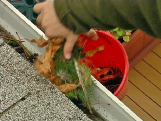 Begin by cleaning debris from gutters. Use a scoop and a bucket to avoid leaving a trail of debris around the house.