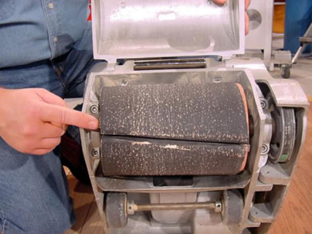 sandpaper wraps around drum of floor sander sandpaper wraps around drum of floor sander