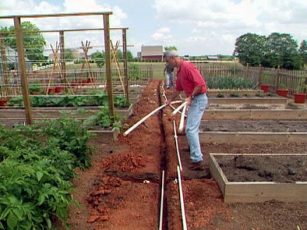 lay long run of pipe down center garden trench lay long run of pipe down center garden trench