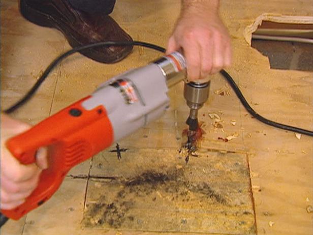 use a drill to open up the holes for water pipes use a drill to open up the holes for water pipes