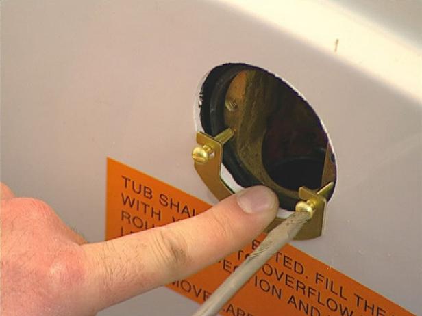 the locking plate is is screwed into the overflow the locking plate is is screwed into the overflow