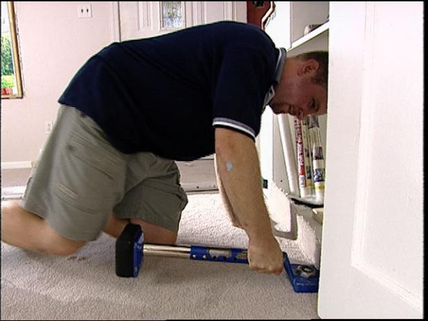 use knee kicker to hook carpet to tackless strip use knee kicker to hook carpet to tackless strip