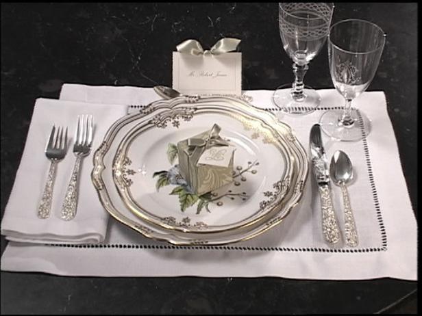 elegant favor boxes are aded to place setting elegant favor boxes are aded to place setting