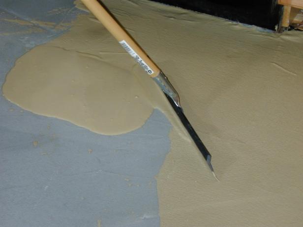 spread thin finish on floor with squeegee spread thin finish on floor with squeegee