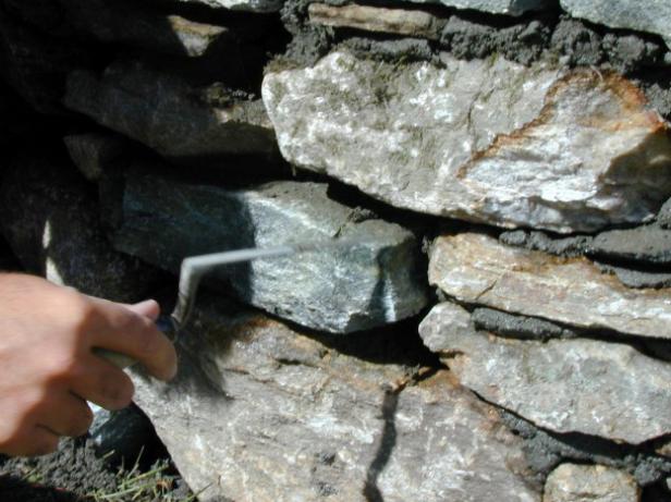 a chipping hammer used to shape stones for firepit a chipping hammer used to shape stones for firepit