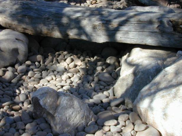 begin lining stream with stones begin lining stream with stones