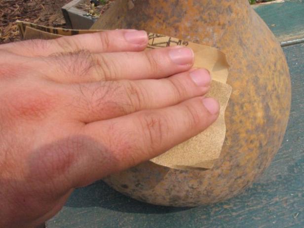 use sandpaper to smooth exterior of gourd use sandpaper to smooth exterior of gourd