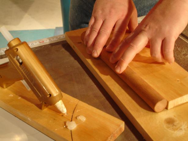 glue dowel to piece of board then cut down center glue dowel to piece of board then cut down center