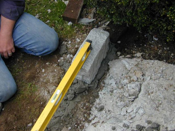 set cobble on ends of footings and work to center set cobble on ends of footings and work to center