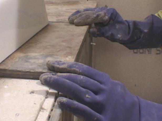 cut and set the tiles under tub cut and set the tiles under tub