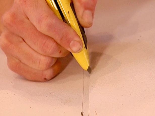use utility knife to trim excess linoleum use utility knife to trim excess linoleum