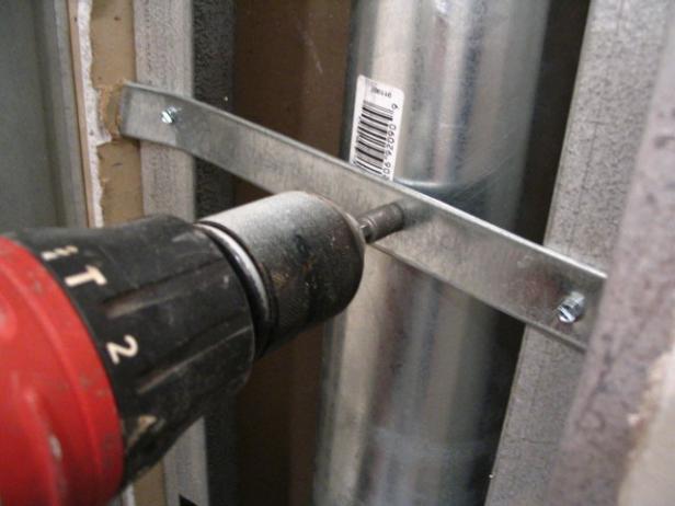 secure duct with metal straps between studs secure duct with metal straps between studs