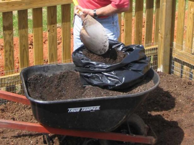 roll down sides of bag and fill with soil roll down sides of bag and fill with soil