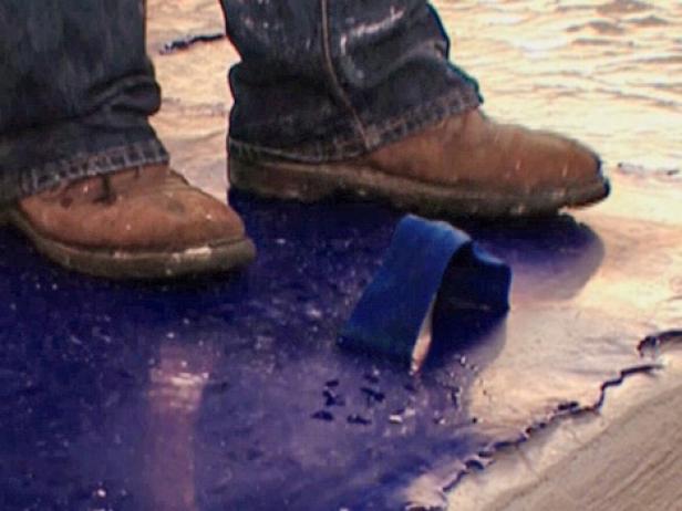 apply stamp to concrete by pressing down with feet apply stamp to concrete by pressing down with feet