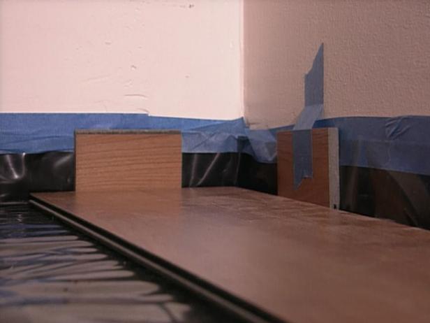 use small sections of planks as spacers from wall use small sections of planks as spacers from wall