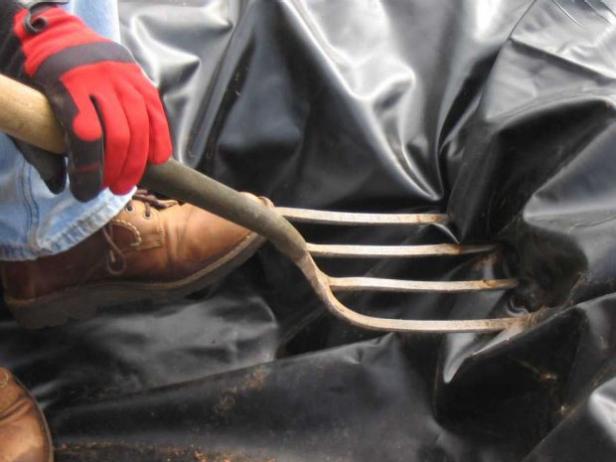 Once you have lined your bog with pond liner, you will need to poke holes in your liner to allow water to flow through it. Use a garden for to punch holes in the bottom and sides of the liner. This keeps most of the water in the bog, but allows excess water to drain into the ground.