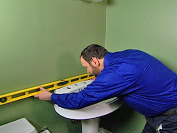 Place the lavatory on the pedestal, and then set it in the desired location. Make sure the lavatory is level