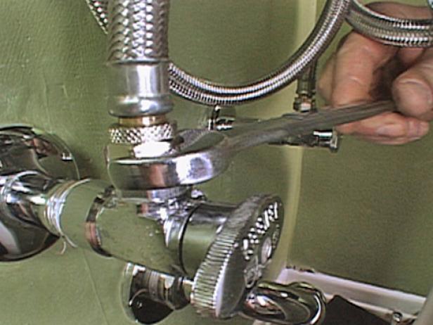 Attach the flexible supply lines to the hot and cold valve bodies, and then attach them to the supply tee. Connect both the hot and cold flexible supply lines to each of the valve bodies, tightening each one with a wrench.