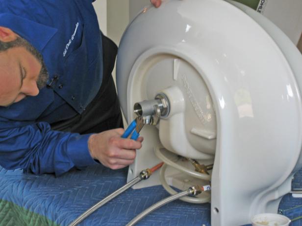 Apply a generous amount of plumber's putty around the base of the flange, and then place the flange in the sink.Place the nylon o-ring and nut over the flange. Tighten with slip-joint pliers. Attach the drain body to the flange, ensuring a tight seal.