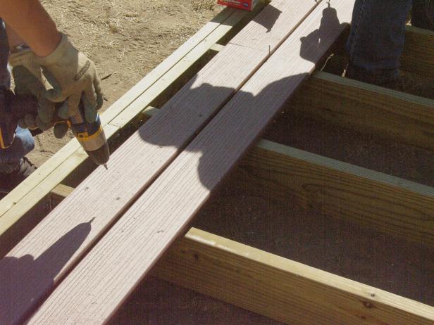Screw down the decking making sure to allow for a 1/4" gap between each plank. Attach several rows and stagger the cut seams for structural and aesthetic value.