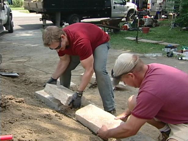 laying the stone for new stone wall laying the stone for new stone wall