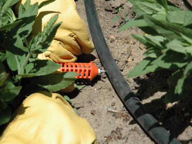 Poke a hole into the main 1/2" tube with an insert tool.