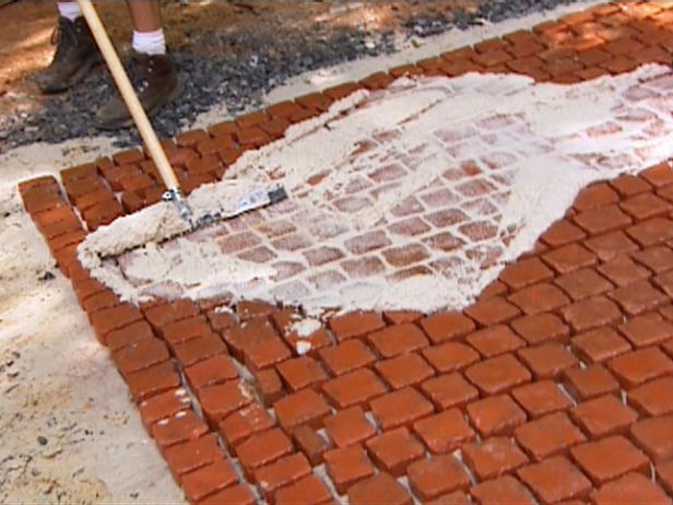 brush mortar over stones and press between joints brush mortar over stones and press between joints