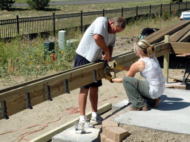 Install joist hangers every 6 inches or so on your ledger board and your end beam.